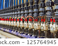 Close-up of an Organized Array of Solenoid Valves and Piping in an Industrial Fluid Control System 125764945