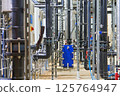 Detailed Interior View of a Complex Industrial Piping and Plumbing System 125764947