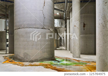 Leakage of Colored Water from Damaged Concrete Support Pillars Possibly Indicating an Issue with a Pool 125764975