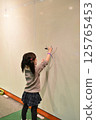 Girl drawing 125765453