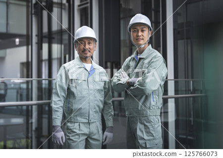 Two workers looking at the camera 125766073