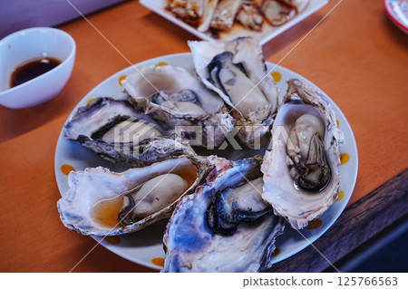 Japanese cuisine Grilled oysters 125766563