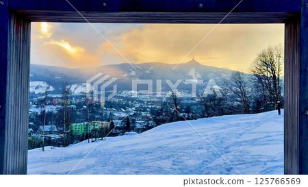 A Stunning Snowy Mountain Landscape Beautifully Framed by Natures Elements and Wonders A Stunning Snowy Mountain Landscape Beautifully Framed by Natures Elements and Wonders 125766569
