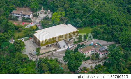 View of a Temple Nestled Among Lush Green Forested Hills View of a Temple Nestled Among Lush Green Forested Hills 125766725