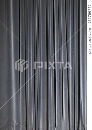 Blue Velvet Curtain with Pleats in a Vertical Fold Pattern 125766772