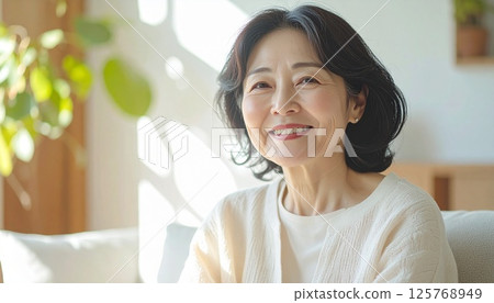 Smiling senior woman enjoying daily life 125768949