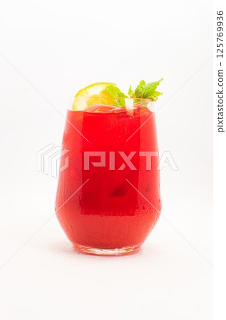 vibrant red berry cocktail with orange slice and fresh mint leaves served in clear glass with ice on white background. High quality photo vibrant red berry cocktail with orange slice and fresh mint leaves served in clear glass with ice on white background. High quality photo 125769936
