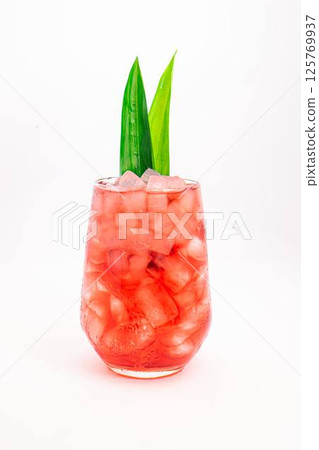 red berry cocktail served in clear glass with crushed ice and green tropical leaves isolated on white background. High quality photo red berry cocktail served in clear glass with crushed ice and green tropical leaves isolated on white background. High quality photo 125769937