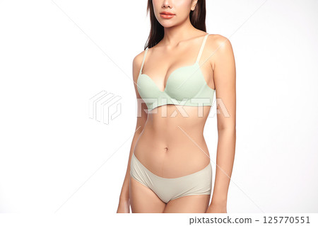 Confident beautiful young asian woman posing in light green lingerie on white background, Perfect body, Confident beautiful young asian woman posing in light green lingerie on white background, Perfect body, 125770551