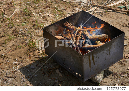 Iron brazier with a grate for hanging smoking products Iron brazier with a grate for hanging smoking products 125772977