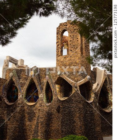 Exterior view of guell crypt, masterpiece gaudi architecture located at catalunya outside town 125773198