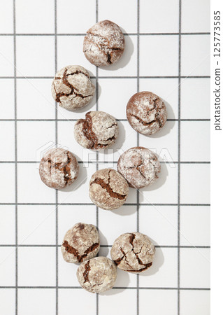 Appetizing Grinkle cookies on a light background. 125773585