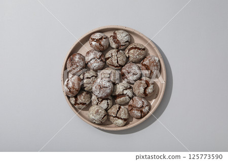 Appetizing Grinkle cookies on a light background. Appetizing Grinkle cookies on a light background. 125773590