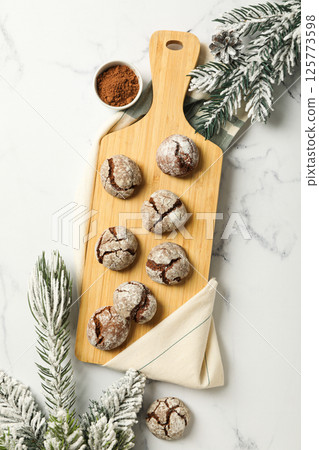 Delicious Grinkle cookies on a wooden board. Delicious Grinkle cookies on a wooden board. 125773598
