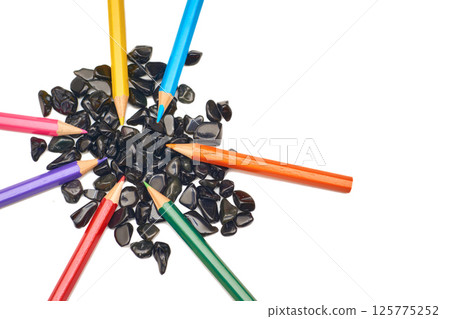 Colored pencils on black stones on white.Inspired,drawing,art 125775252