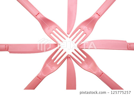 Pink plastic knife, forks for camping, isolated on white 125775257