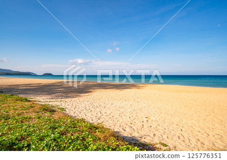 Empty tropical beach and seascape, Beautiful sandy beach and sea in sunny day,Blue sky in good weather day, Beach sea space area nature background 125776351