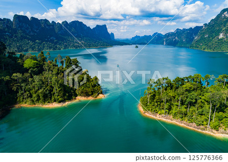 Aerial view drone shot of scenery mountains tropical rainforest in thailand,Khao Sok Thailand Scenic mountains with lake in Khao Sok National Park 125776366
