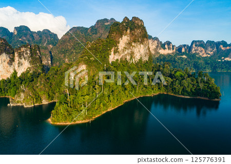 Aerial view drone shot of scenery mountains tropical rainforest in thailand,Khao Sok Thailand Scenic mountains with lake in Khao Sok National Park 125776391