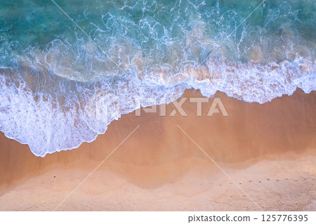 Amazing Top view sea beach landscape background,Summer sea waves crashing on sandy shore seascape background,High angle view ocean nature background Amazing Top view sea beach landscape background,Summer sea waves crashing on sandy shore seascape background,High angle view ocean nature background 125776395