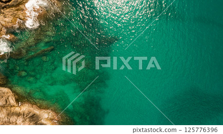 Top view waves crashing on rocks seascape background,Wide angle sea nature background 125776396