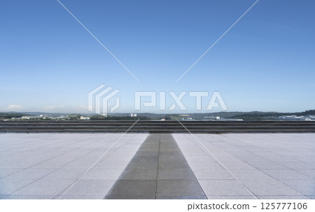 Panoramic skyline and buildings with empty concrete square floor 125777106