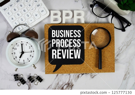 BPR - Business Process Reengineering acronym with calculator, alarm clock and magnifying glass, Business concept 125777130