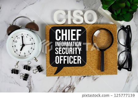 CISO - Chief Information Security Officer acronym with alarm clock and magnifying glass, Data management concept background 125777139