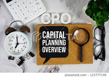 CPO - Capital Planning Overview acronym with calculator, alarm clock and magnifying glass, business concept background 125777146