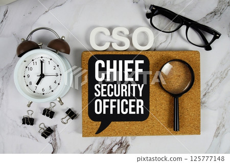 CSO - Chief Security Officer acronym with alarm clock and magnifying glass, technology concept background 125777148