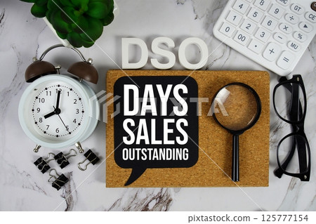 DSO - Days Sales Outstanding acronym with calculator, alarm clock and magnifying glass, Business concept background DSO - Days Sales Outstanding acronym with calculator, alarm clock and magnifying glass, Business concept background 125777154
