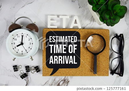 ETA - Estimated Time Of Arrival acronym with alarm clock and magnifying glass, business concept background 125777161