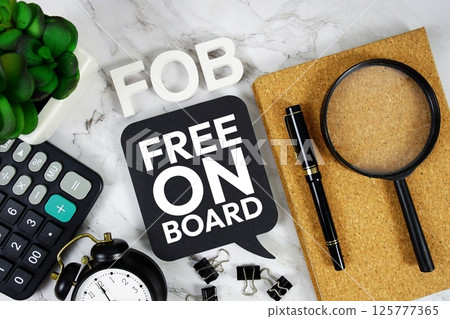 FOB - Free On Board acronym with calculator, alarm clock and magnifying glass, business concept background 125777365