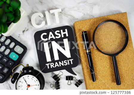 CIT - Cash in Transit acronym with calculator, alarm clock and magnifying glass, Business concept background 125777386