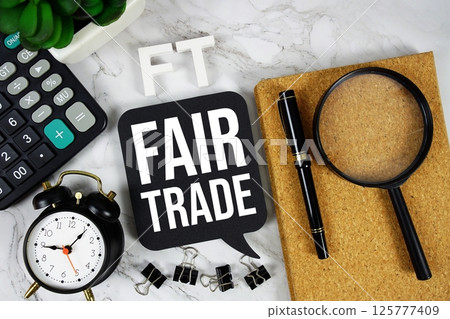 FT - Fair Trade acronym with calculator, alarm clock and magnifying glass, Business concept background FT - Fair Trade acronym with calculator, alarm clock and magnifying glass, Business concept background 125777409