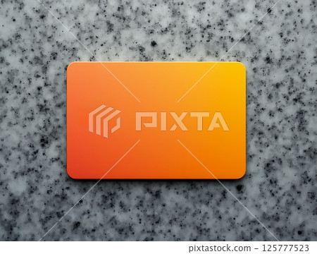 Gradient card on a textured stone surface showcasing warm orange tones and smooth edges in a modern aesthetic 125777523