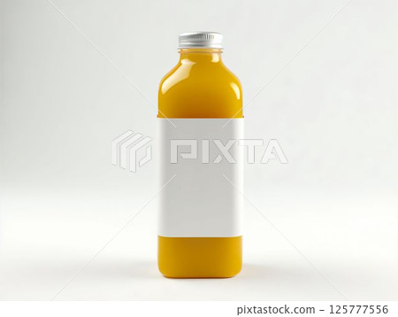 Bright orange juice bottle with a blank label placed on a light background in a minimalistic design setting Bright orange juice bottle with a blank label placed on a light background in a minimalistic design setting 125777556