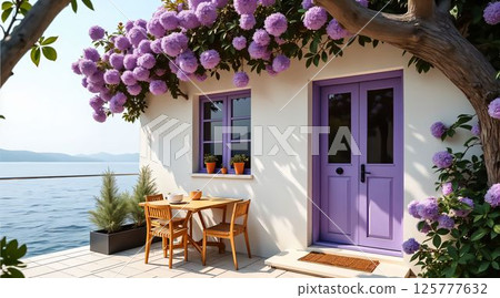 Charming waterfront cottage adorned with purple flowers and a cozy dining setup by the water 125777632