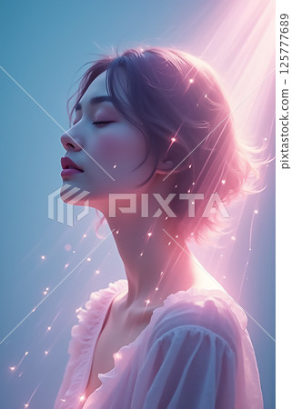 Serene woman in soft light with sparkles and dreamy atmosphere Serene woman in soft light with sparkles and dreamy atmosphere 125777689