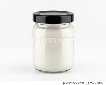 Jar filled with white substance on plain background showcasing simple design and clarity 125777892