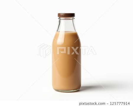 Creamy beverage in glass bottle with wooden cap placed on a light background 125777914