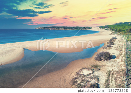 Beautiful sunset on the beach. Playa Bolonia. Duna de Bolonia. Spain, Europe 125778238