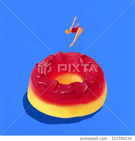 Young slim woman in red swimming suit and cap diving into giant gummy candy as pool against blue background. Contemporary art collage 125780139