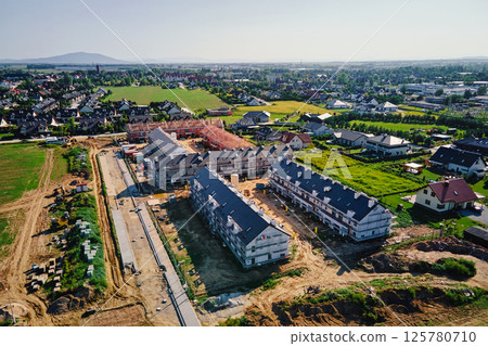 Aerial view of residential construction site in suburban area 125780710