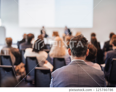 Interview and round table discussion at business convention and presentation. Audience at the conference hall. Business and entrepreneurship symposium. 125780786