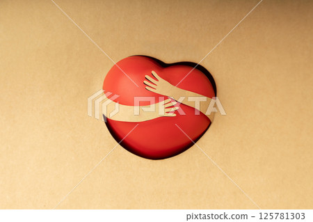 Love Yourself Concept. Paper Cut as Arms Embracing a Red Heart Shape. Positive Mind. Wellbeing Mental Health. Single in Valentines Day 125781303