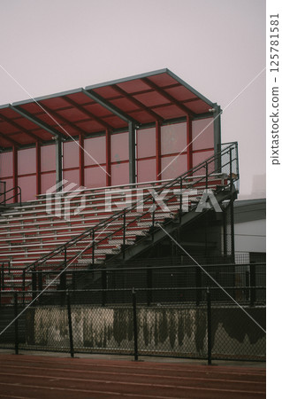 A large stadium featuring bright red seats and a striking red roof A large stadium featuring bright red seats and a striking red roof 125781581