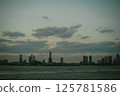 A stunning skyline with the majestic statue of liberty in front 125781586