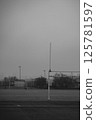 A black and white photo of a football field with a goal post 125781597