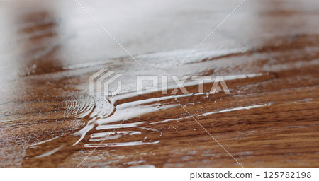 freshly applied oil finish to black walnut board freshly applied oil finish to black walnut board 125782198